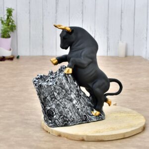 Black Bull Figurine with Golden Horns | Polyresin Climbing on Rock Showpiece for Modern Home Décor, Office Table & Gifting